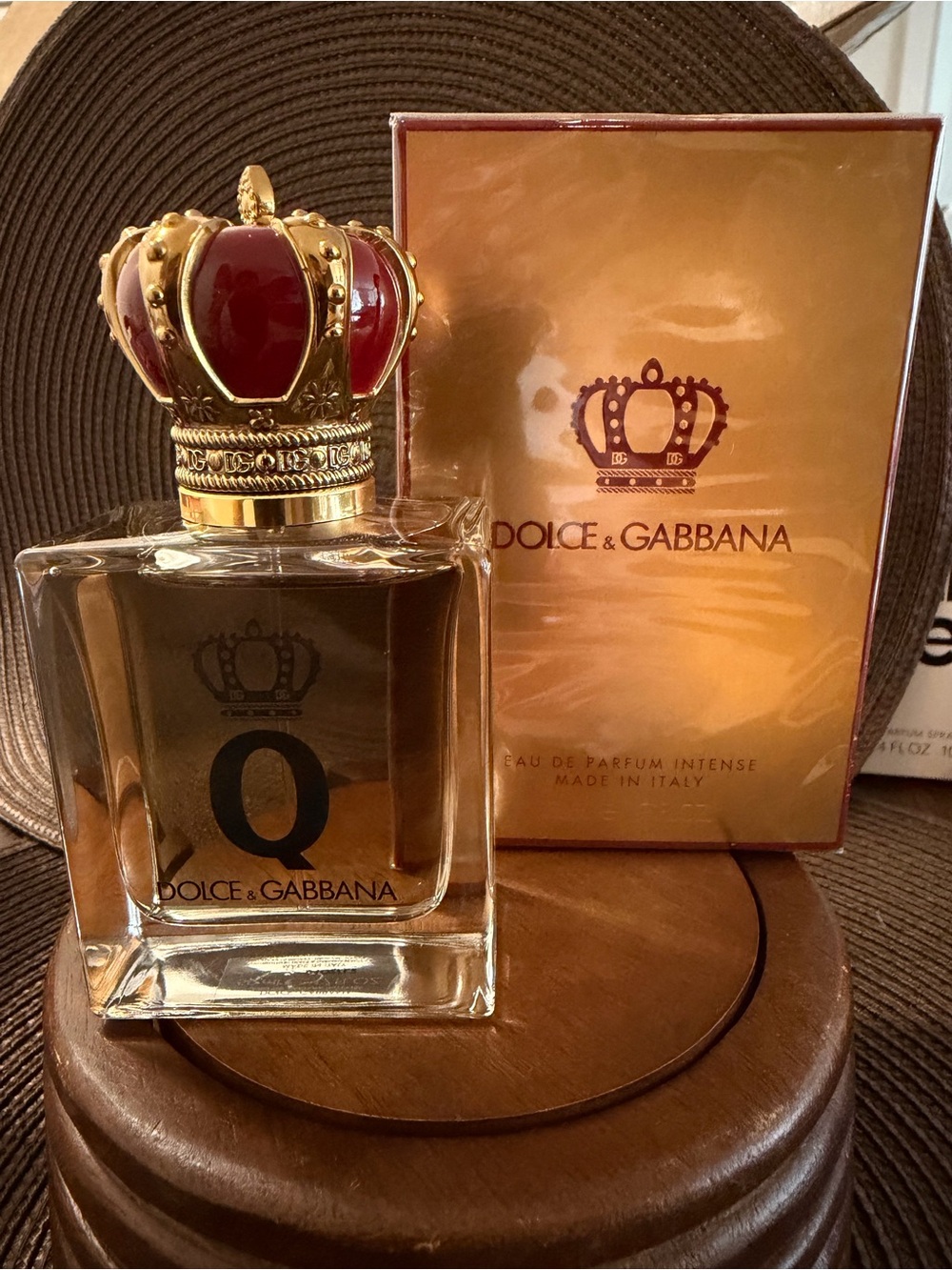 Dolce & Gabbana crown-top perfume bottle in gold and red